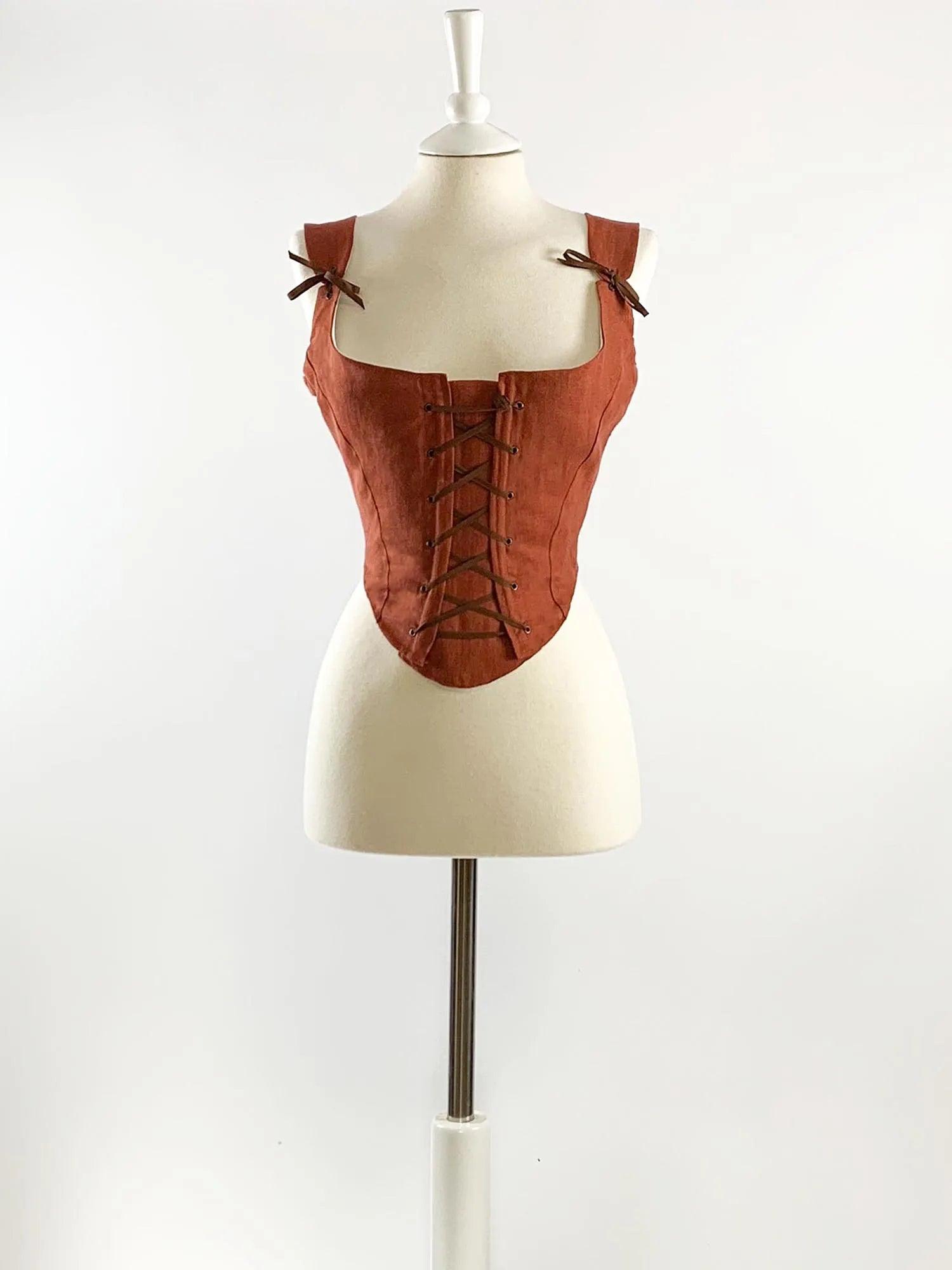 https://atelier-serraspina.com/cdn/shop/files/isolde-renaissance-corset-rust-orange-linen-2.webp?v=1710066353